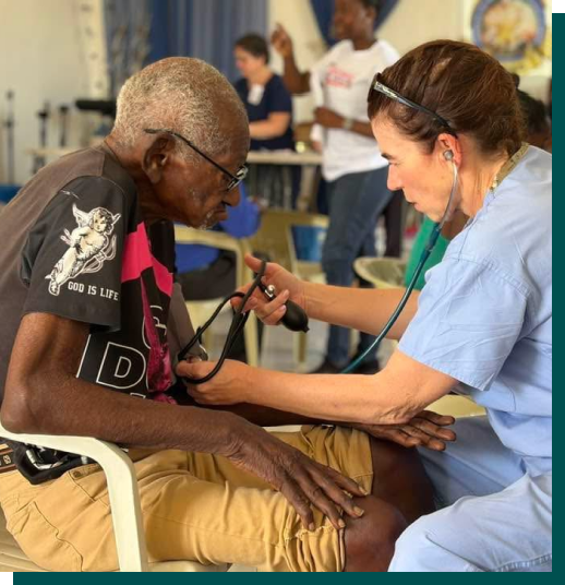 A healthcare worker caring for a patient