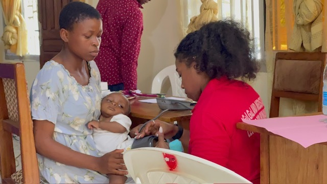Noah, eight months old, alert and smiling after treatment through a MAP medical mission.